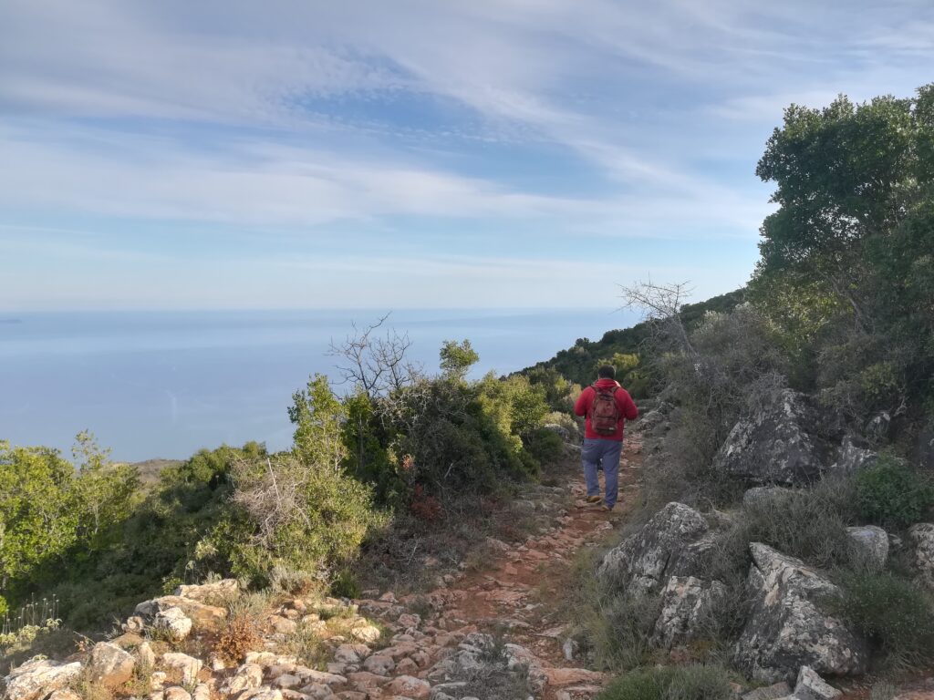 A hiker walking on a trail in Kynouria